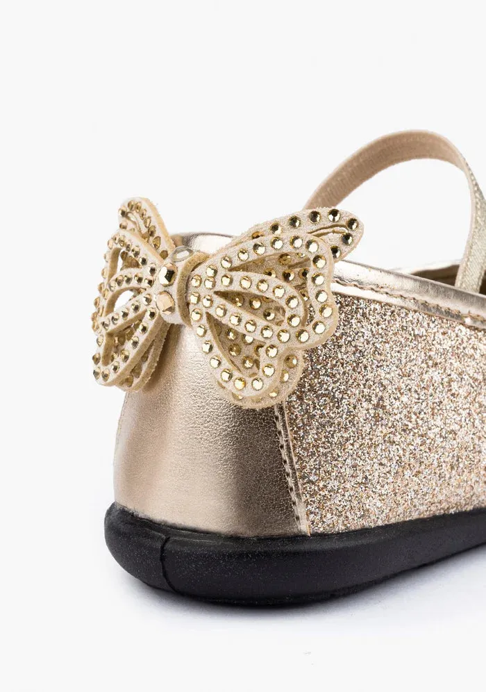 Gold glitter ballerina with a rhinestone bow